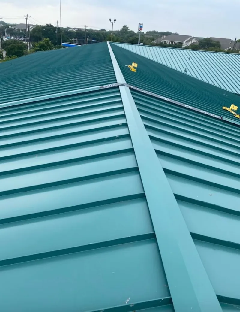 Green commercial metal roof ridge and valley for Metal Roof Repair in Victor